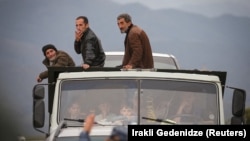 ARMENIA -- Refugees from Nagorno-Karabakh region arrive by truck in the border village of Kornidzor, Armenia, September 26, 2023. 