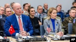 US Ambassador to NATO Matthew Whitaker (left) and European Union foreign policy chief Kaja Kallas attend a meeting of the Ukraine Defense Contact Group in Brussels on April 11.