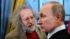 RUSSIA – Russian Prime Minister Vladimir Putin (R) and Editor-in-chief of Ekho Moskvy radio station Alexei Venediktov at the ceremony where the Russian Federation Government awards in the field of print media were presented. Moscow, January 13, 2012