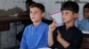 Afghan refugee children attend lessons at the refugee camp where they live near Peshawar, Pakistan.