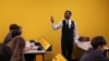 Physics teacher Umar Ukasha theaching Moldovan students in Chisinau
