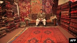 Afghanistan -- A shopkeeper waits for customers in his shop on Chicken Street in Kabul, 03Mar2012
